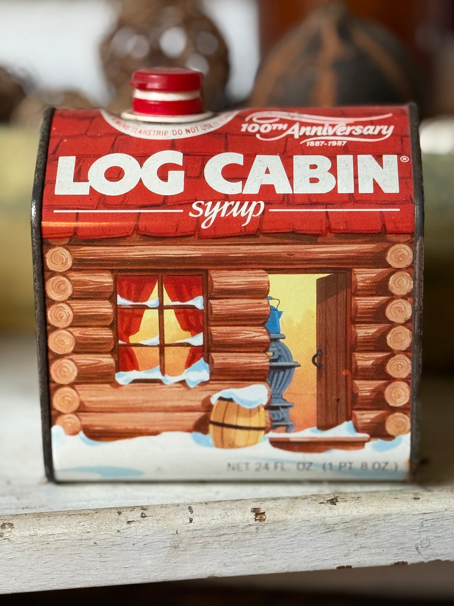 Tin — Log Cabin syrup