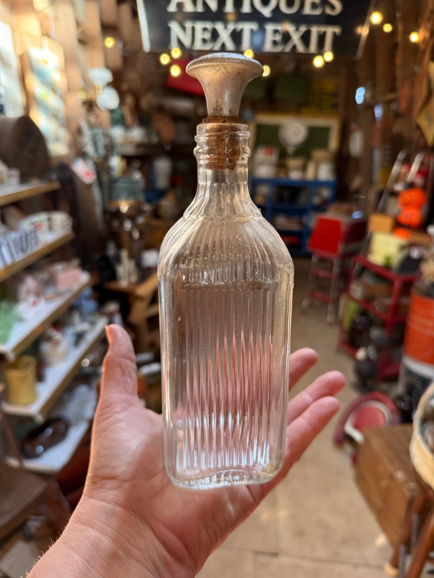 Sprinkle head on glass bottle